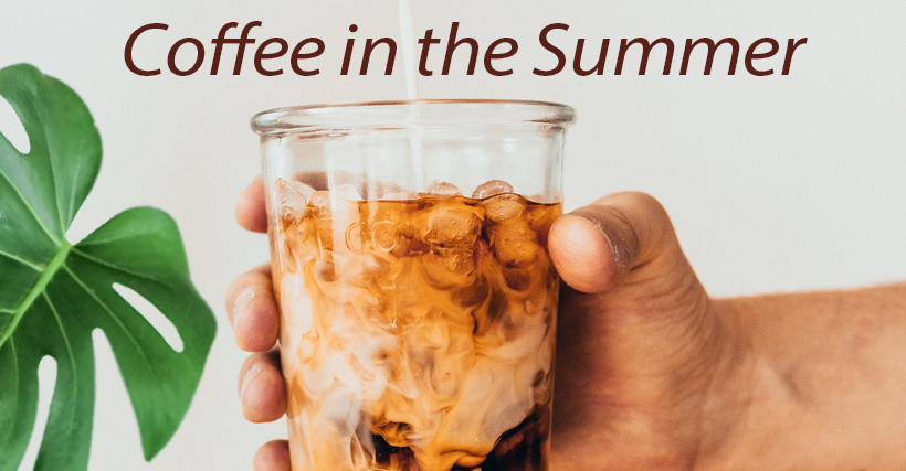 A hand holds a glass of iced coffee with swirling cream, with a green monstera leaf visible to the left and the text "Coffee in the Summer" at the top.