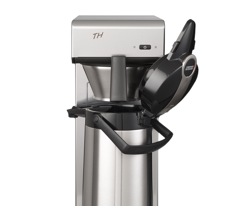 Close-up of a silver Bravilor Bonamat TH filter coffee machine with its brew head open over a stainless steel thermal airpot.