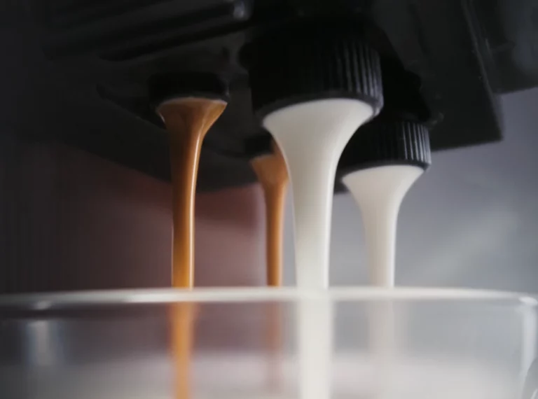 A brown circular icon featuring a white outline of a gear and a green wrench centered inside it, with a small green circle containing a white checkmark in the upper-right corner.