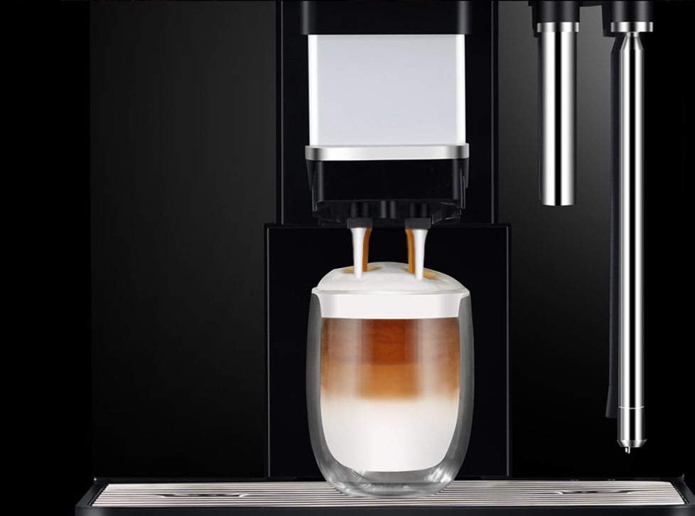 A horizontal banner showcasing three different bags of Uasal roasted whole coffee beans—Oir (yellow), Dearg (red), and Gorm (blue)—arranged next to a cloth sack of coffee beans and a stamp graphic that reads "Roasted in Ireland."