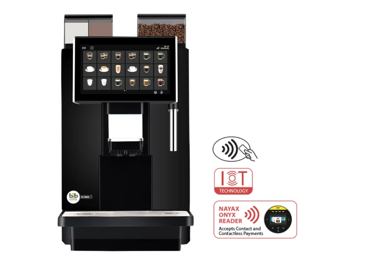 A front-facing office coffee machine shot of the B-1500 bean-to-cup coffee machine with two separate ingredient hoppers, a large digital touch menu, and icons for IoT technology and Nayax contactless payment.