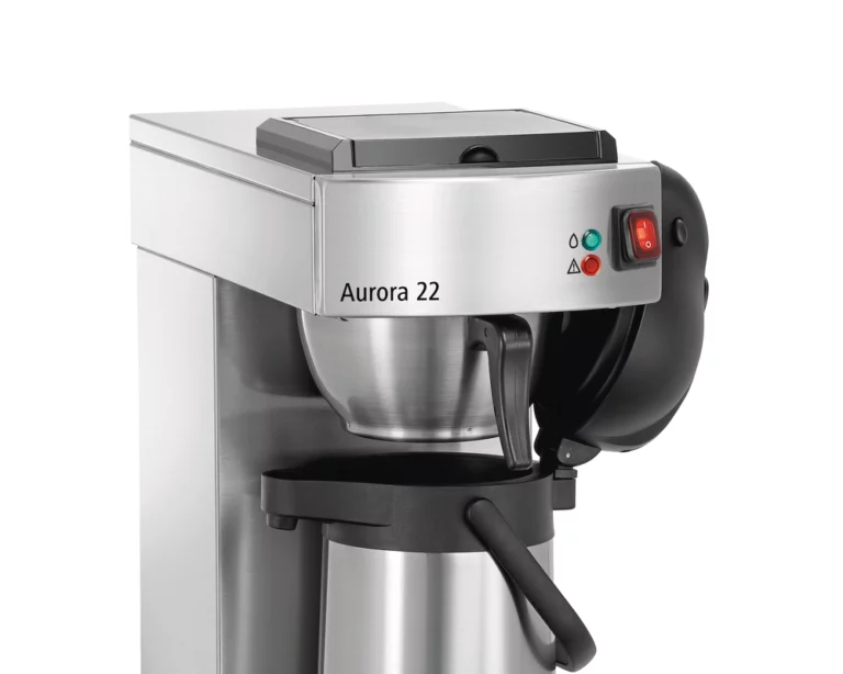 A professional studio shot of the upper section of an Aurora 22 stainless steel filter coffee machine, showing the brew head, control switch, and the top of a thermal airpot.