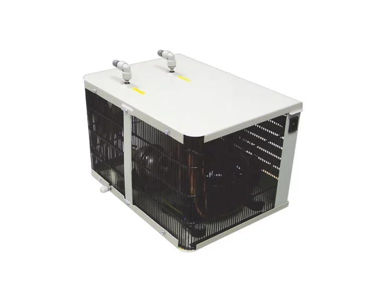 A high-resolution technical product shot of an industrial undercounter water chiller unit with a white top panel, black ventilation grilles, and dual water line connectors.