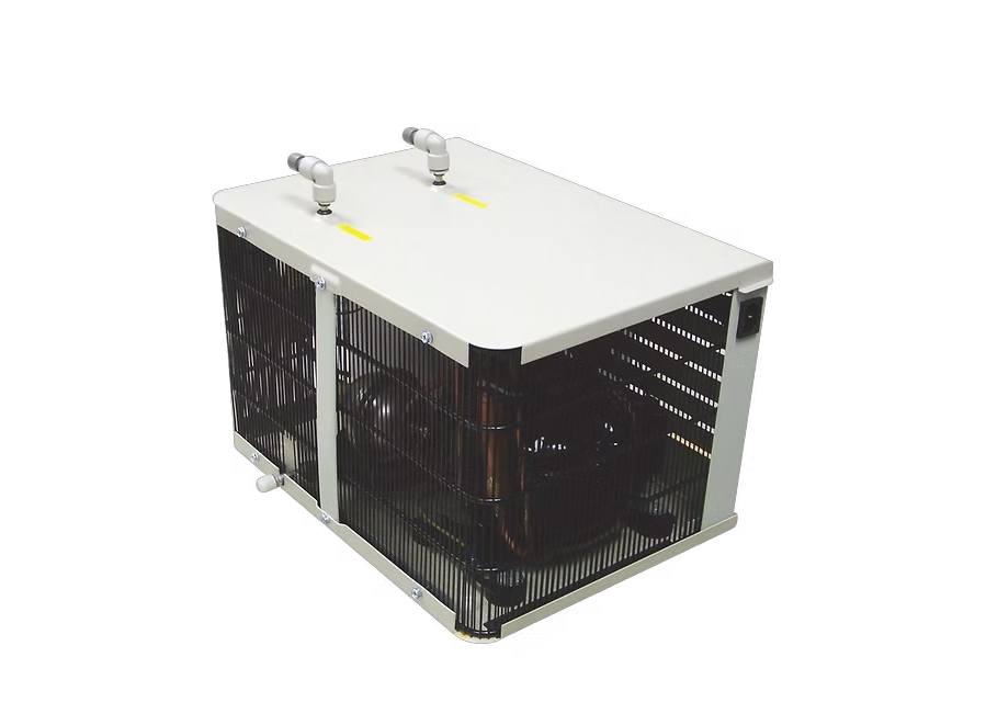 A high-resolution technical product shot of an industrial undercounter water chiller unit with a white top panel, black ventilation grilles, and dual water line connectors.