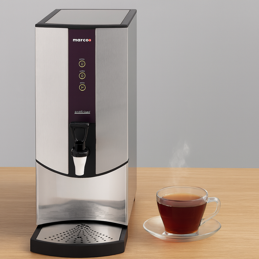 A Marco Ecoboiler T10 hot water dispenser on a wooden surface, featuring a traditional black dispensing lever and a steaming glass cup of tea on a clear saucer.